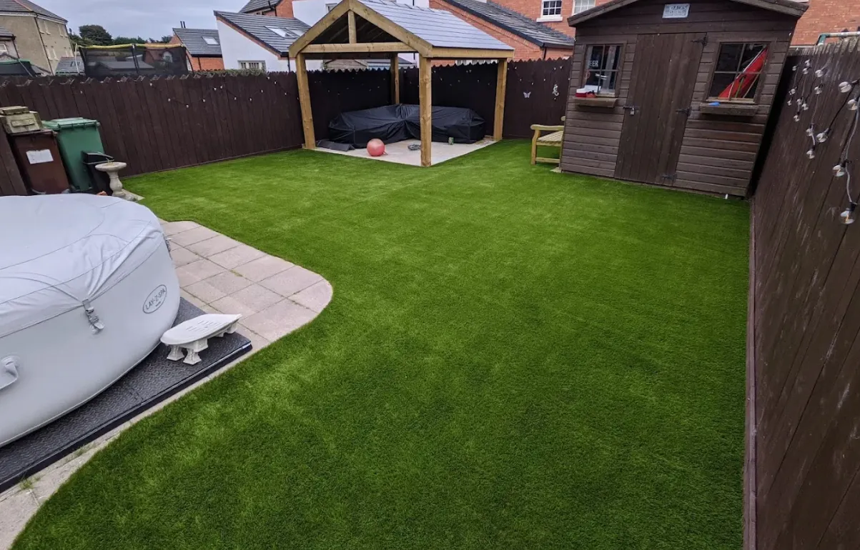 Artificial grass lawn completed by Farnham Driveways & Patios